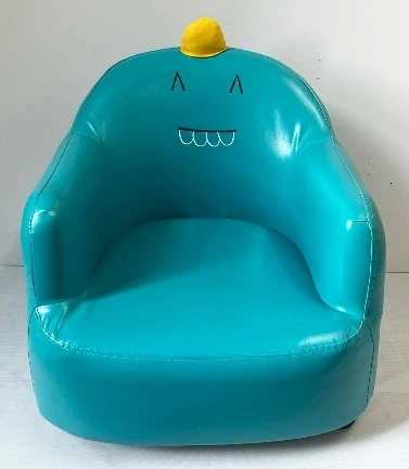 Teal cartoon monster themed children's armchair with yellow horn detail