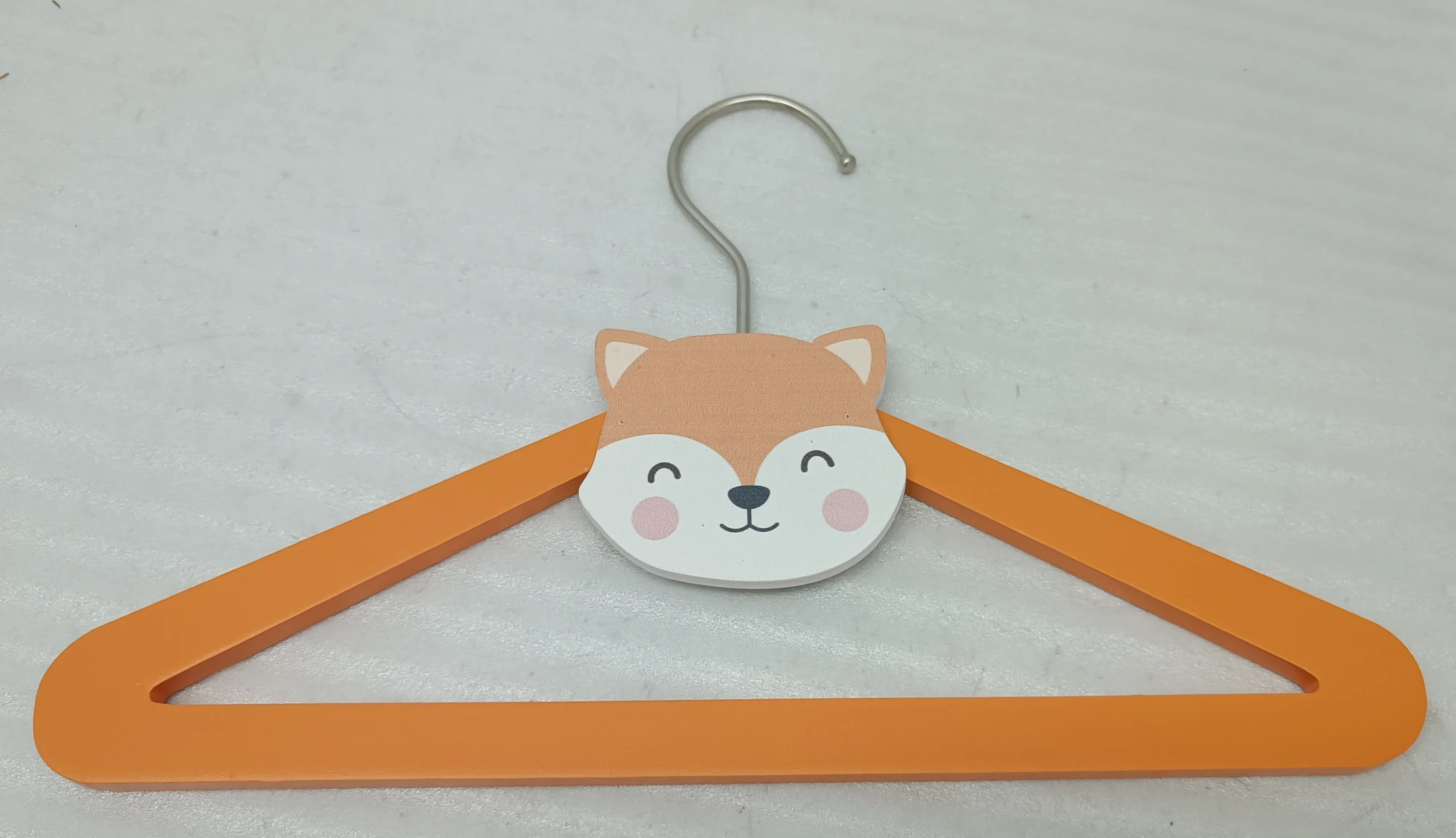 Wooden clothes hanger with cartoon fox face design