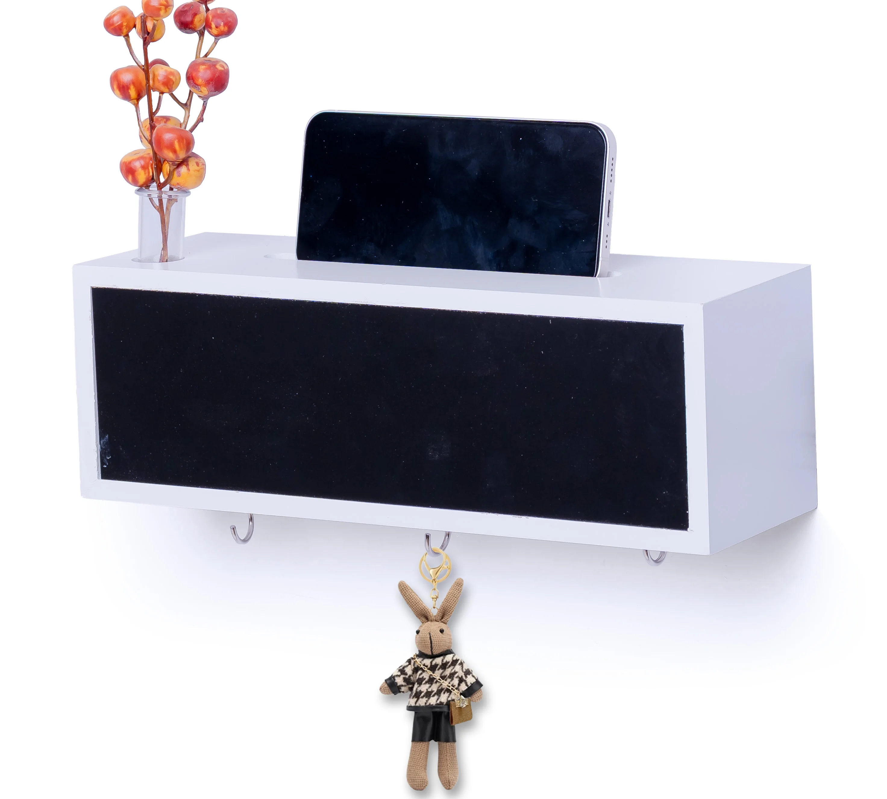 Wall-mounted white shelf with phone holder and hooks